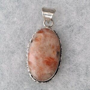 2/20$ NWOT oval orange sunstone oval 925 pendant